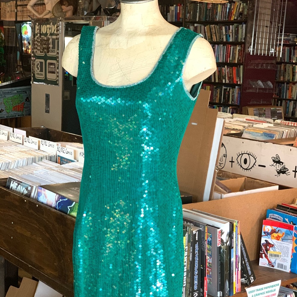 Sequin teal evening dress.